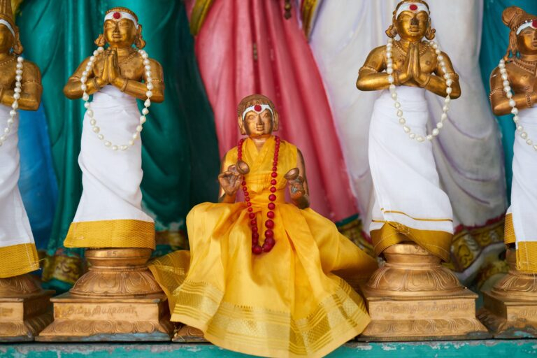 statues man praying scaled 1