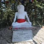 Meditating sage statue at sacred shrine image