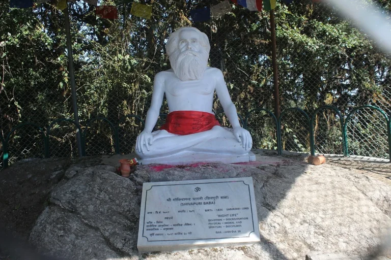 Meditating sage statue at sacred shrine image