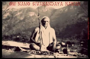Swami Sivananda seated in meditation holding staff against Himalayan mountain backdrop portrait
