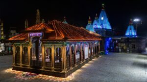 Illuminated Kolhapur temple night photo.