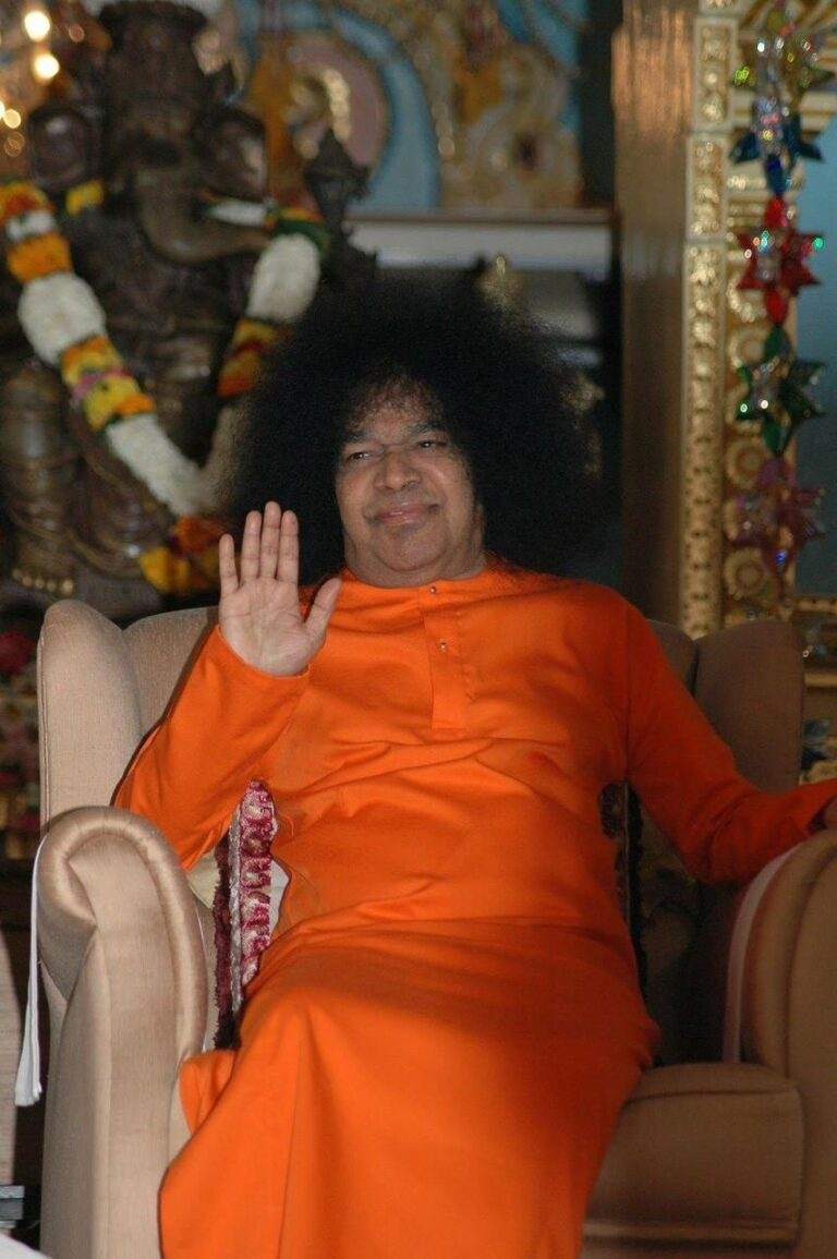 Sai Baba blessing devotees with peaceful raised hand
