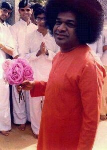 Sri Sathya Sai with flowers photo