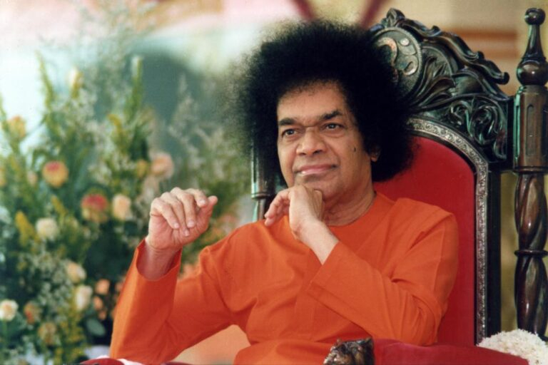 Sathya Sai Baba seated thoughtfully image