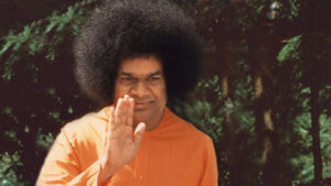 Sai Baba blessing devotees with raised compassionate hand