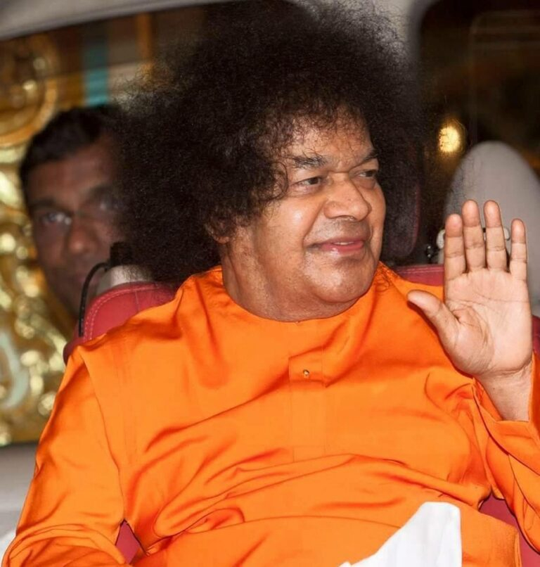 Sai Baba blessing devotees with raised hand
