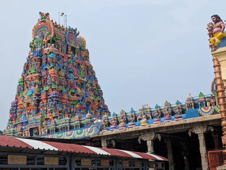 Colorful South Indian temple gopuram beside mandapam