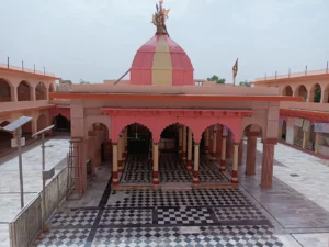 Sacred Hindu temple featuring peaceful courtyard and colorful architecture