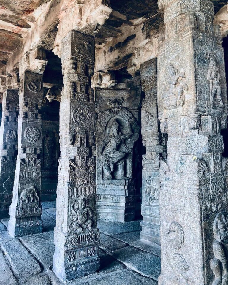 Ancient temple pillars with intricate carvings