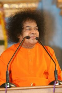 Spiritual leader speaking at podium with microphones photo