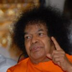 Spiritual leader speaking with raised finger photo
