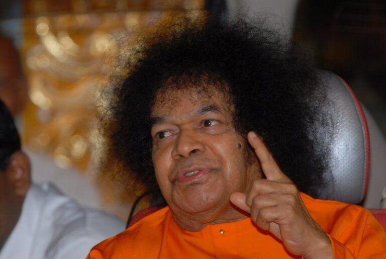 Spiritual leader speaking with raised finger photo