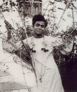 Young Sathya Sai Baba standing outdoors image