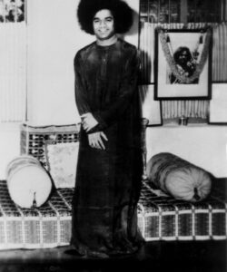 shri sathya sai baba Monochrome figure in traditional attire.