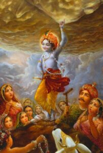 Lord Krishna lifting Govardhan Hill image
