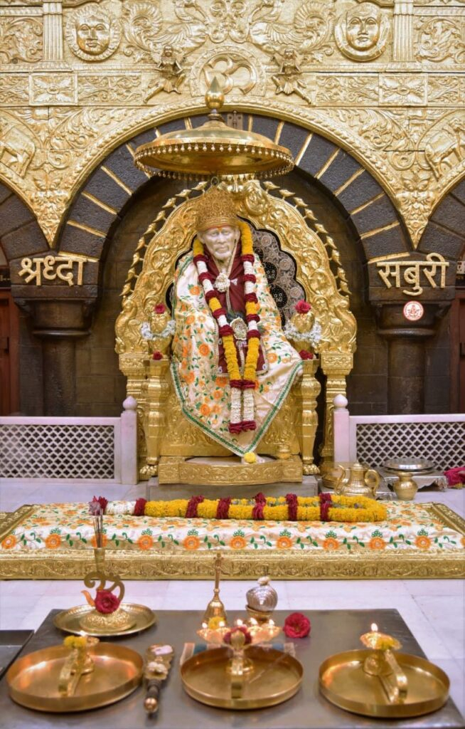 Shirdi Sai Baba seated on golden throne image