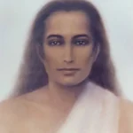 Serene portrait of a long-haired spiritual master wearing a white robe against soft background