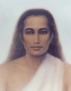 Serene portrait of a long-haired spiritual master wearing a white robe against soft background