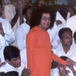 Shri Sathya Sai Baba blessing his devotees