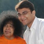 Shri Sathya Sai Baba with devotee