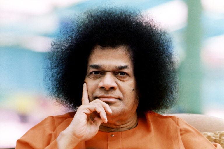Sathya Sai Baba looking thoughtful portrait picture.