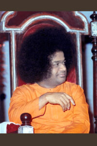 Sathya Sai Baba seated in peaceful picture.
