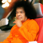 Sathya Sai Baba in car portrait picture.