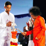 Shri Sathya Sai Baba lamp blessing picture.