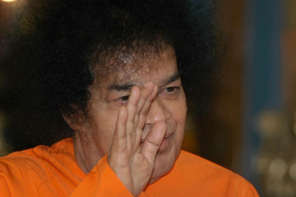 Shri Sathya Sai Baba raised hand blessing image