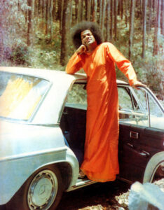 Sathya Sai Baba giving blessings to devotees picture
