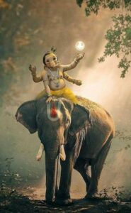 Bal Ganesha seated upon majestic elephant