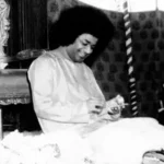Sri Sathya Sai Baba smiling with loving compassion