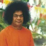 Bhagwan Shri Sathya Sai Baba standing peacefully outdoors
