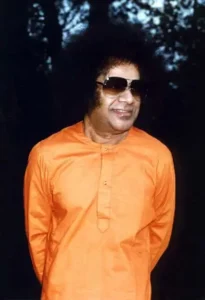 Bhagwan Shri Sathya Sai Baba wearing sunglasses outdoors