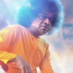 Sri Sathya Sai Baba surrounded by divine radiant light