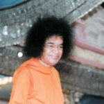 Shri Sathya Sai Baba smiling during divine darshan