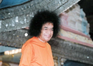 Shri Sathya Sai Baba smiling during divine darshan