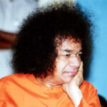 Shri Sathya Sai Baba in thoughtful contemplative pose