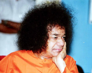 Shri Sathya Sai Baba in thoughtful contemplative pose