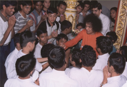 Sri Sathya Sai Conversations with Lion Dance Students 62 Sathya Sai Baba blessing devotees with raised hand photo