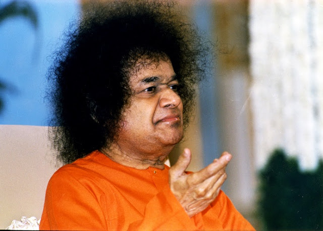 Sathya Sai Baba seated on divine throne picture