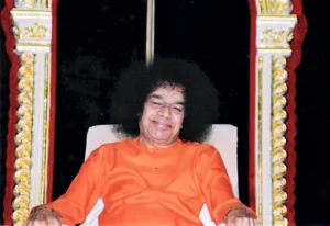 Smiling Sathya Sai Baba seated image