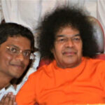 Bhagwan Shri Sathya Sai Baba blessing devoted follower