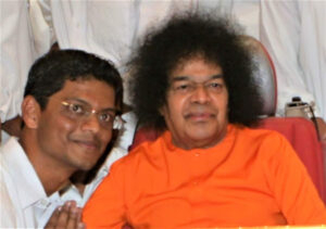 Bhagwan Shri Sathya Sai Baba blessing devoted follower