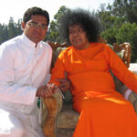 Bhagwan Shri Sathya Sai Baba with devotee image