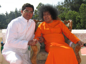 Bhagwan Shri Sathya Sai Baba with devotee image