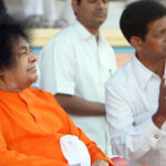 Bhagwan Shri Sathya Sai Baba guiding devotee image