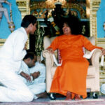 Sathya Sai Baba seated in a chair.