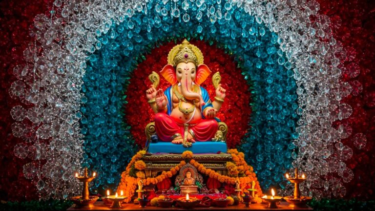 Lord Ganesha idol with colorful floral backdrop