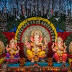 Decorated Lord Ganesha idols in festive pandal